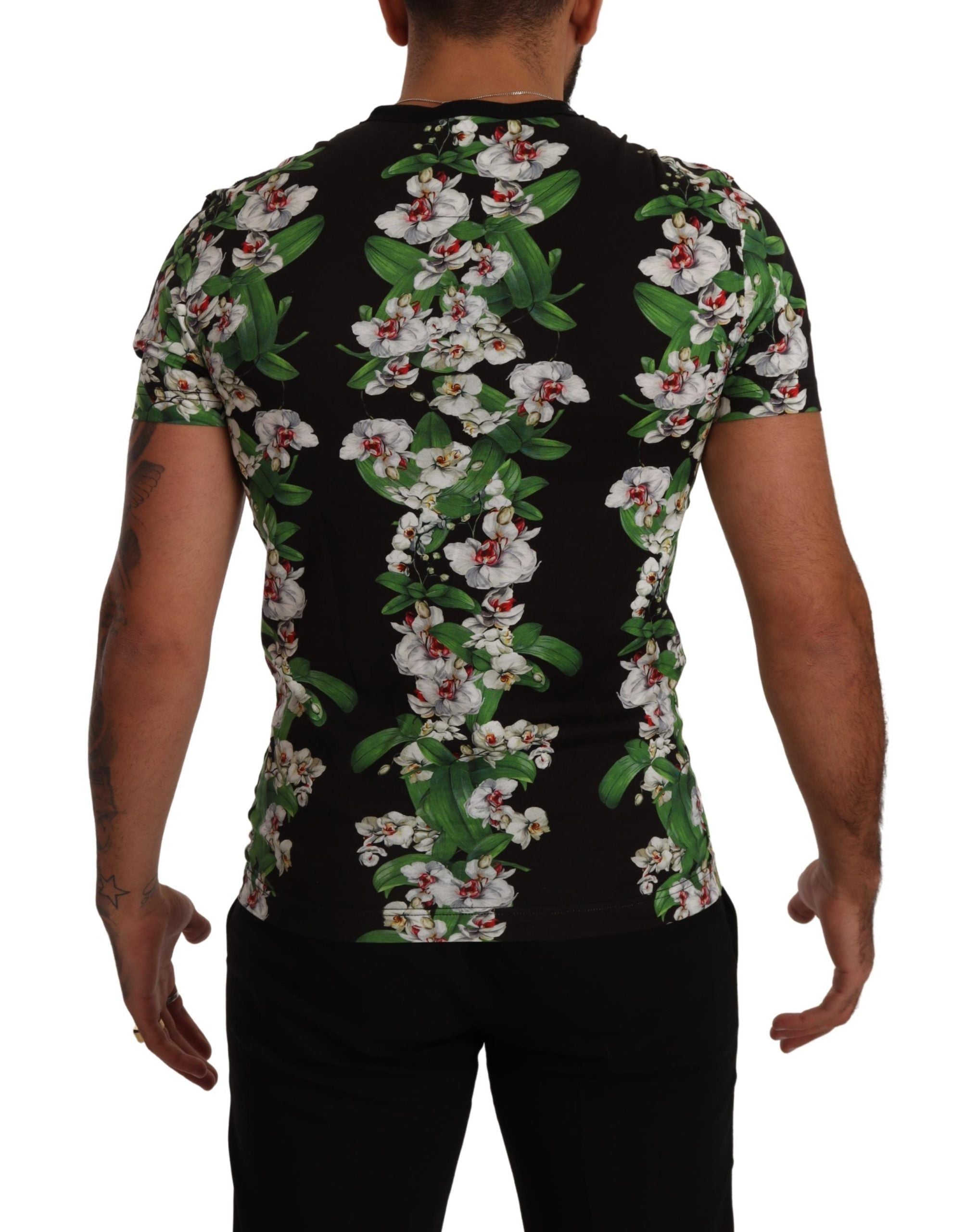 T-shirt à col rond noir Dolce & Gabbana avec imprimé floral coloré, tissu en coton, visible sur l'image.