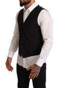 Veste formelle noire Dolce & Gabbana pour femme, design élégant et sophistiqué, en tissu chic et ajusté.