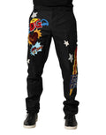 Pantalon pour homme Dolce & Gabbana noir avec broderie graphique et détails élégants, style moderne et sophistiqué.