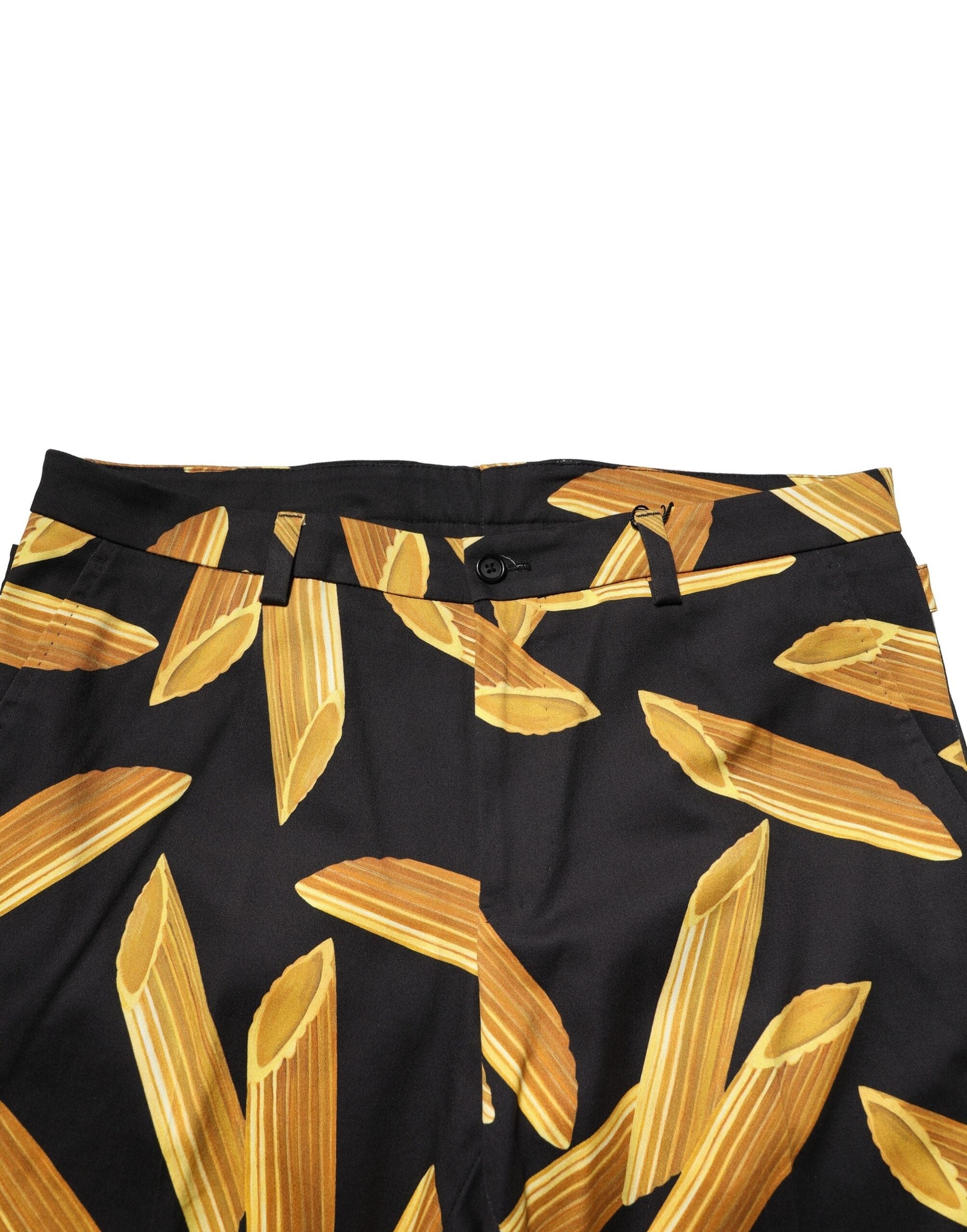 Pantalon homme Dolce & Gabbana noir à motif pâtes, coupe fuselée, style élégant et tendance.