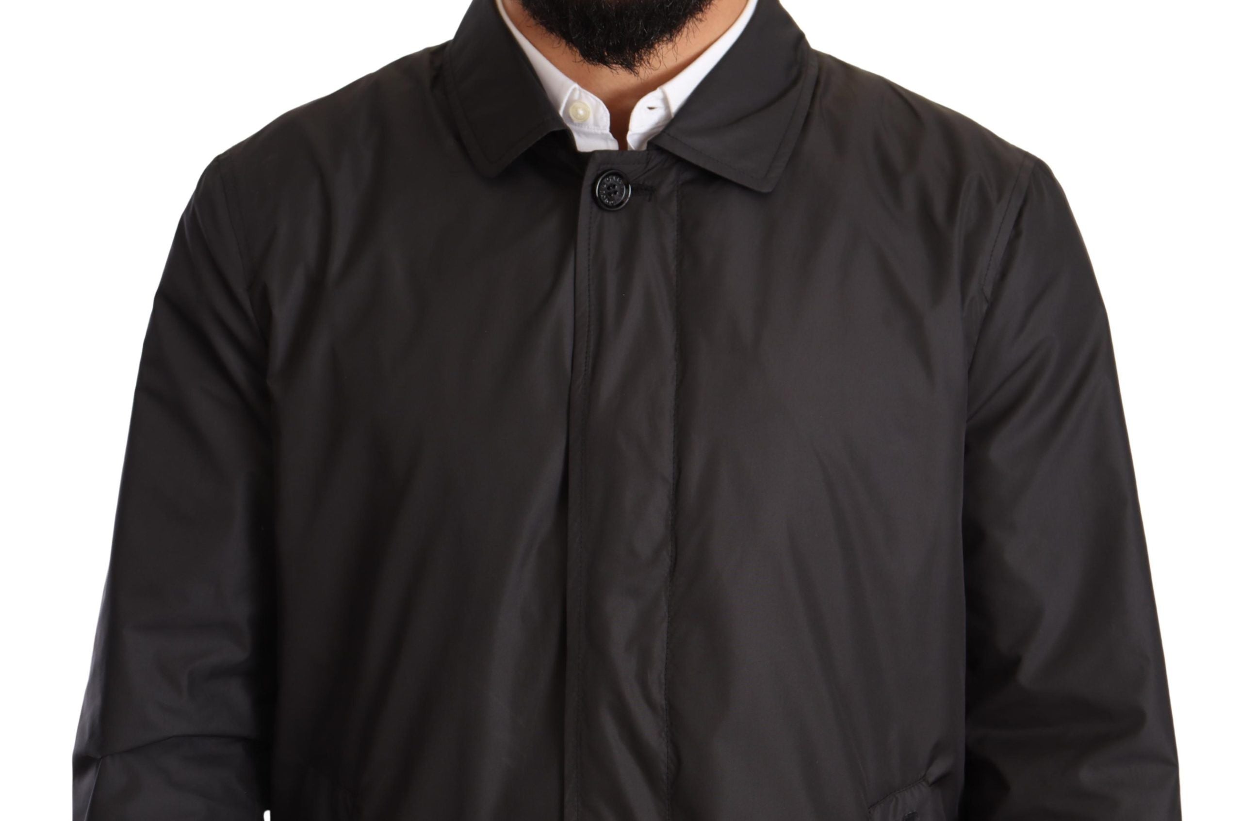 Manteau trench noir pour homme en polyester de Dolce & Gabbana, veste élégante avec col et boutons visibles.