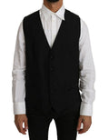 Gilet en laine et soie noire de Dolce & Gabbana, veste classique élégante avec détails soignés, sur un fond neutre