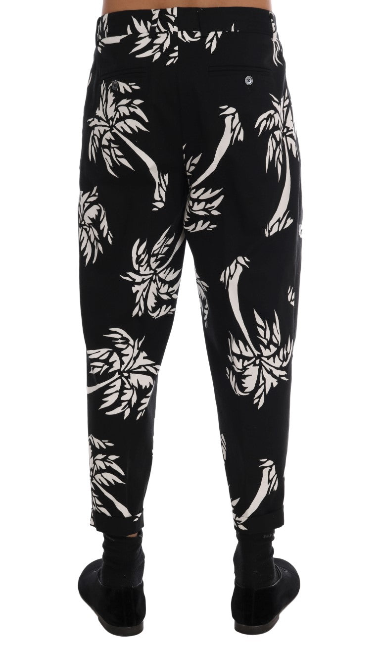 Pantalon noir en coton stretch Dolce & Gabbana avec motif arbre, coupe ajustée et détail élégant.