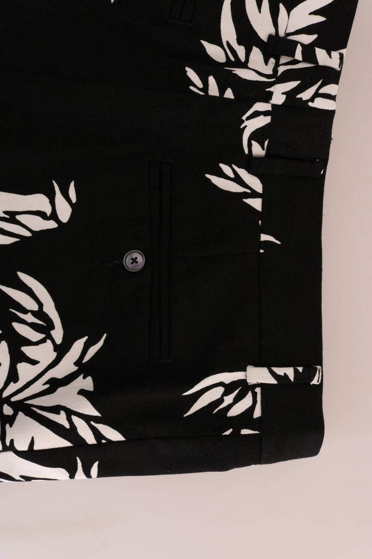 Pantalon noir en coton extensible Dolce & Gabbana avec motif arbre, coupe ajustée et style élégant.