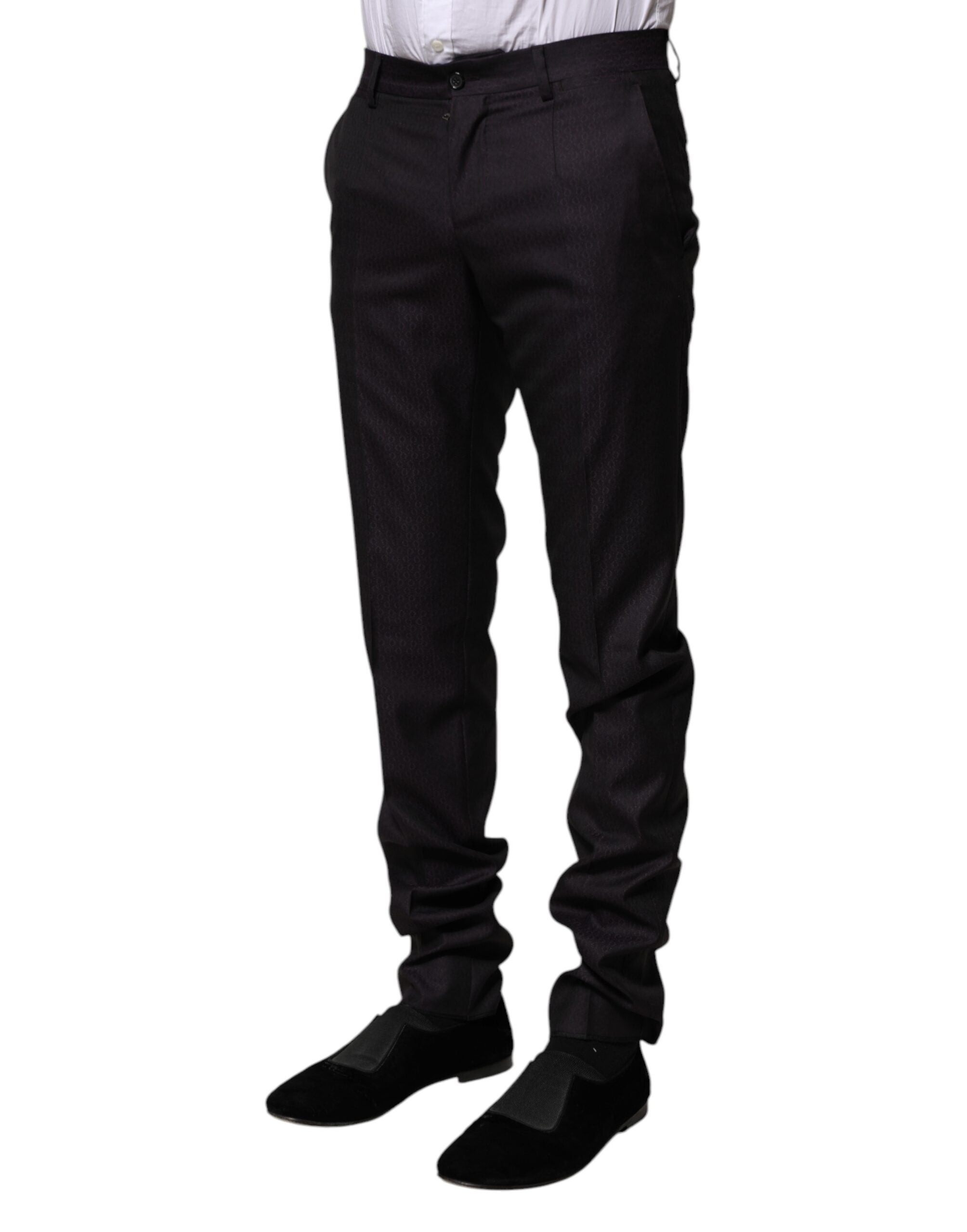 Pantalons formels en laine noire à motif de Dolce & Gabbana, élégants et sophistiqués, visibles en détail sur la photo