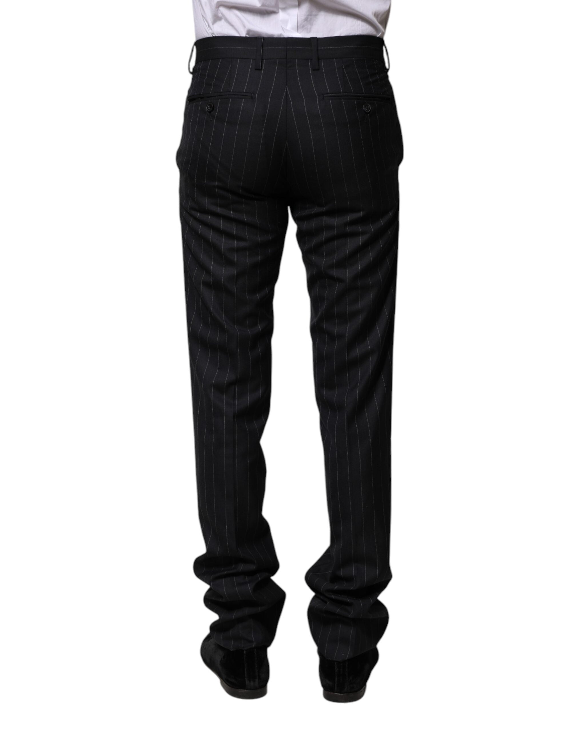 Pantalon formel en laine noire à rayures Dolce & Gabbana, élégant et sophistiqué, visible avec ceinture et coupe ajustée.