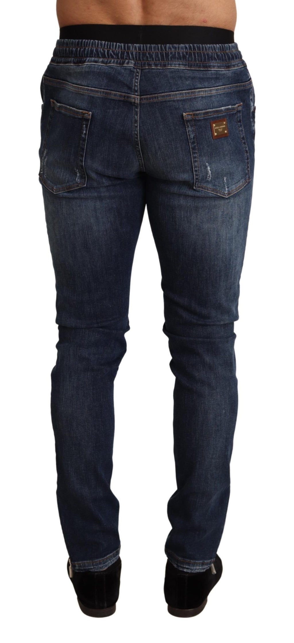 Jeans en jean déchiré en coton stretch bleu de Dolce & Gabbana, style décontracté avec détails usés.