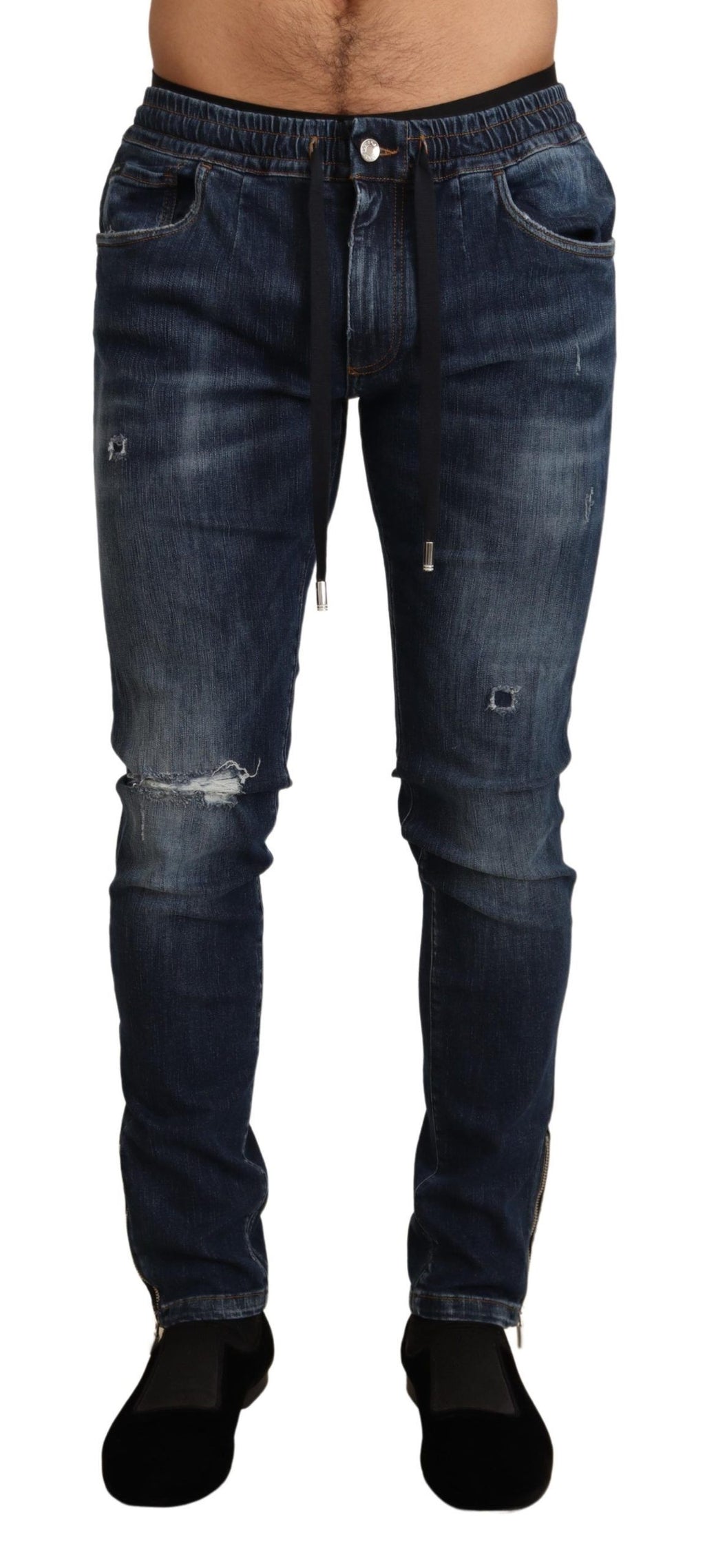 Jeans en denim tattered bleu en coton extensible de Dolce & Gabbana, coupe décontractée et détails usés visibles.