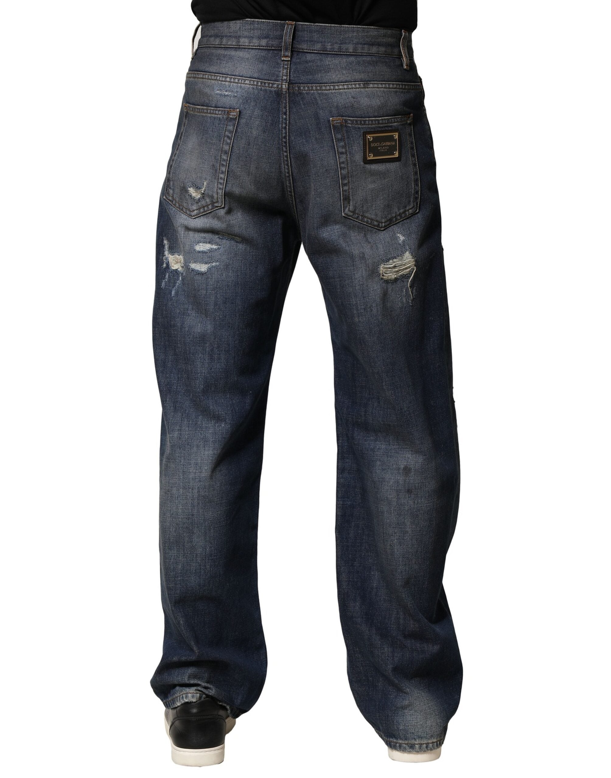 Jeans pour homme en coton bleu délavé et usé de Dolce & Gabbana, style tattered, avec une coupe décontractée.