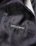 Costume homme en laine bleue Dolce & Gabbana à trois pièces, veste croisée à boutonnières simples et pantalon assorti.