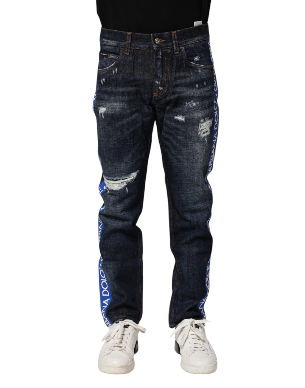 Jeans skinny en denim bleu foncé déchiré de Dolce & Gabbana, style tattered, ajustés, avec détails usés et déchirés visibles.