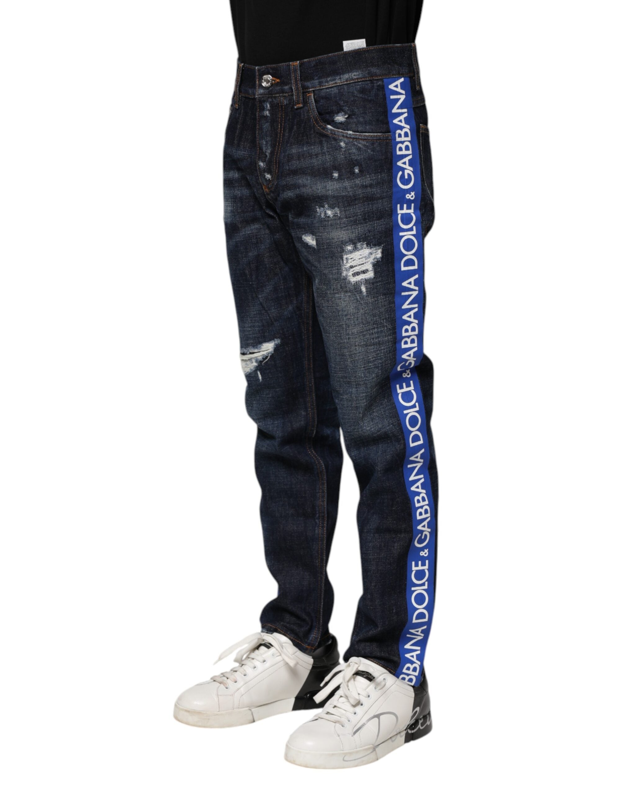 Jeans skinny déchirés bleu foncé de Dolce & Gabbana, style décontracté avec détails usés, en denim extensible.