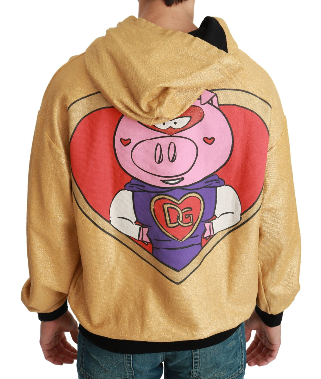 Sweat à capuche doré Dolce & Gabbana Pig of the Year avec logo et design animalier, porté sur un modèle.