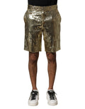 Shorts Bermuda dorés en polyester avec sequins et embellissements Dolce & Gabbana, vue de face.