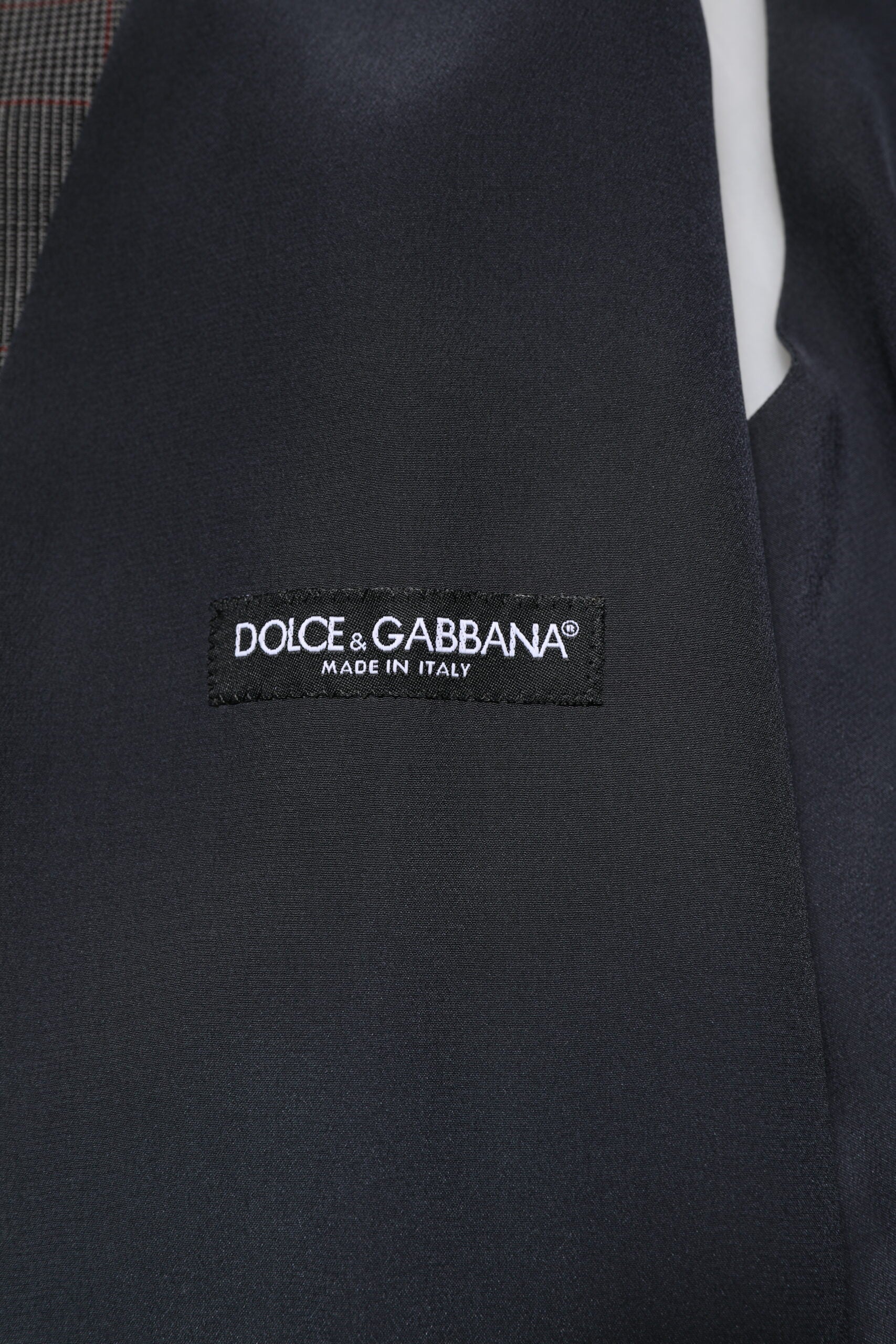 Gilet en laine à carreaux gris Dolce & Gabbana, veste formelle élégante avec coupe ajustée.