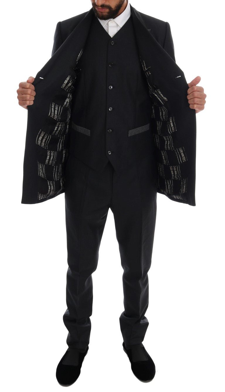 Costume trois pièces en laine gris de Dolce & Gabbana, veste croisée à double boutonnage avec pantalon et gilet assortis.