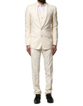 Costume homme en laine ivoire Dolce & Gabbana, trois pièces, veste croisée et pantalon élégant, vue de face.