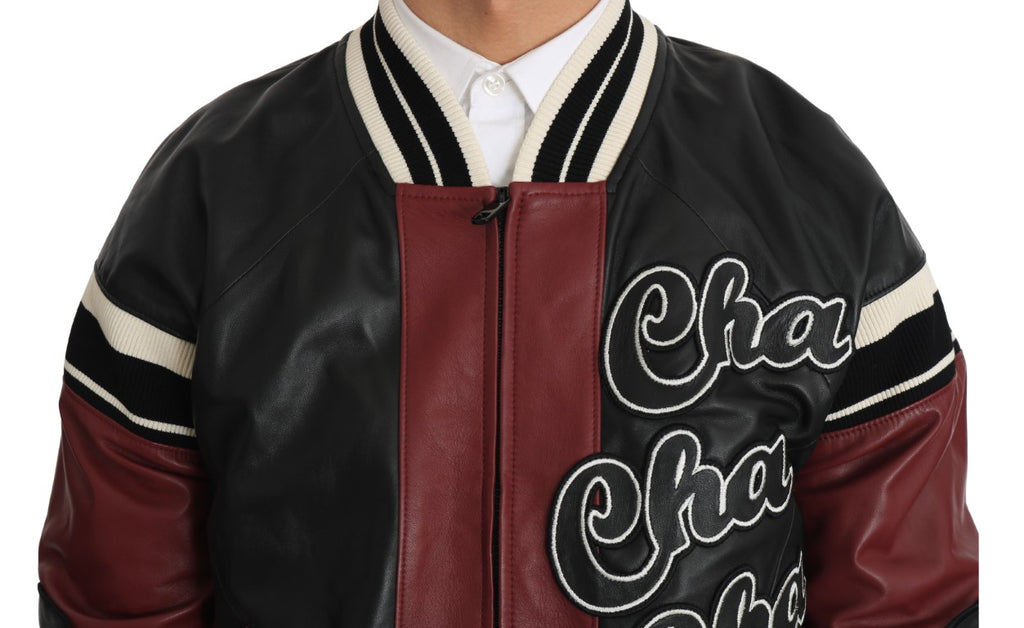 Veste en cuir noire et rouge Dolce & Gabbana pour club lounge, avec design élégant et détails sophistiqués.