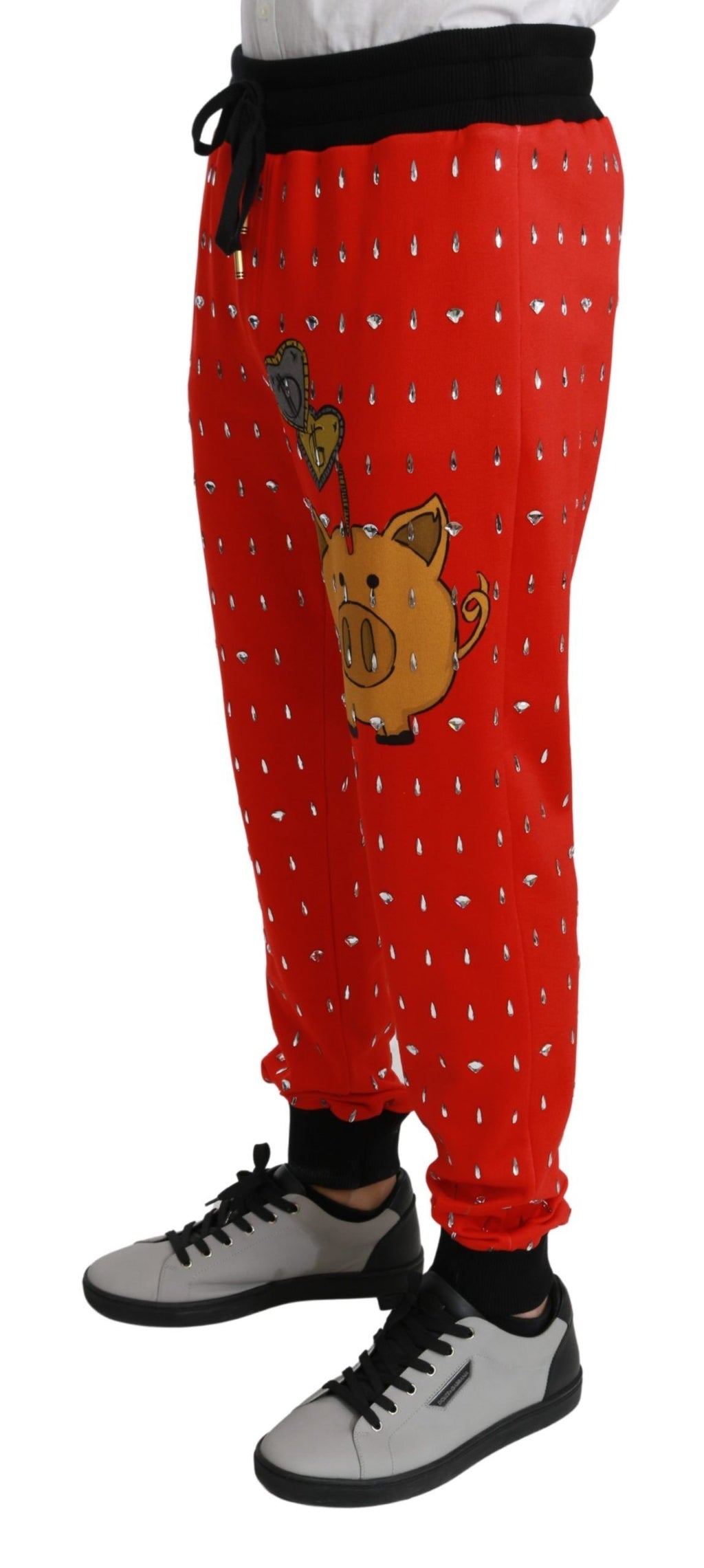 Pantalons Dolce & Gabbana en coton avec motifs cristal rouge, style pantalon de coffre-fort, vue de face sur le produit.