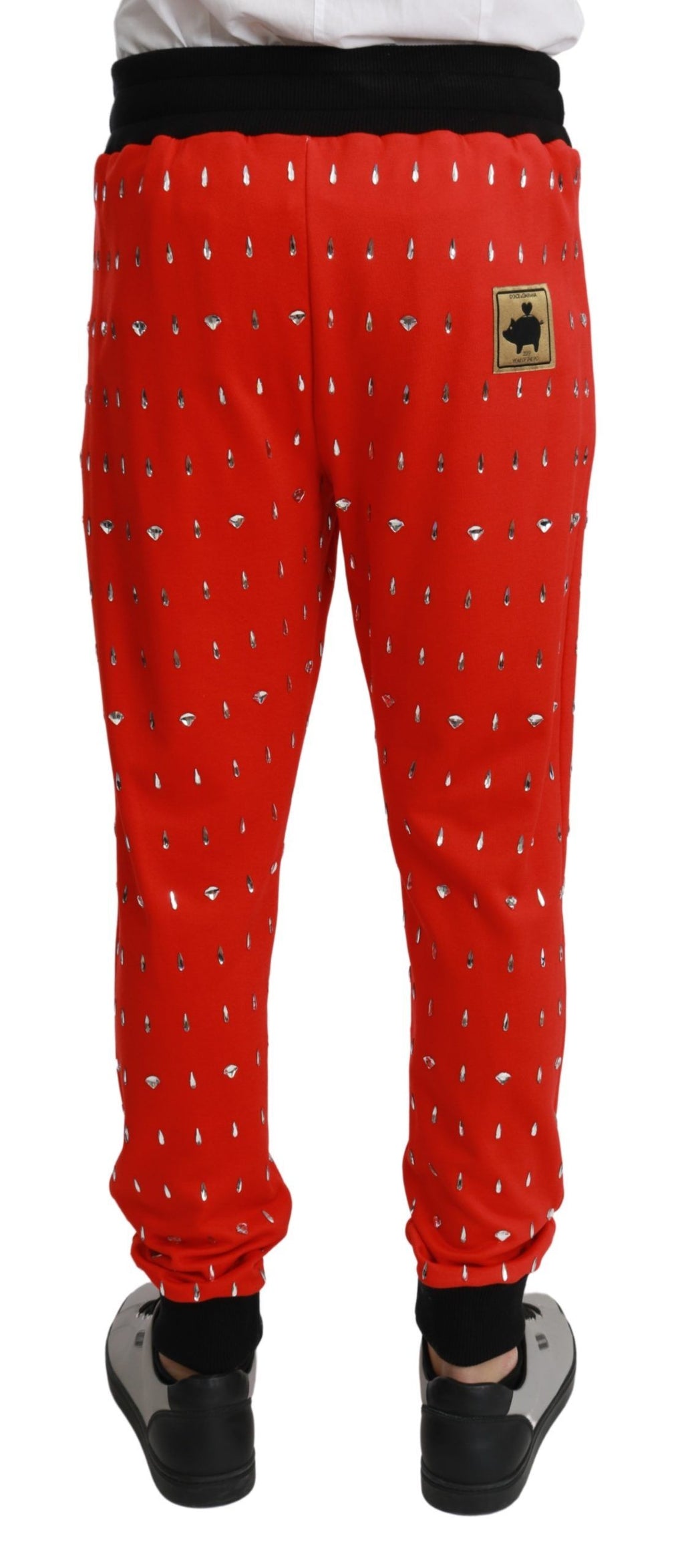 Pantalons Dolce & Gabbana en coton rouge avec détails en cristal, style piggy bank, vue frontnelle.