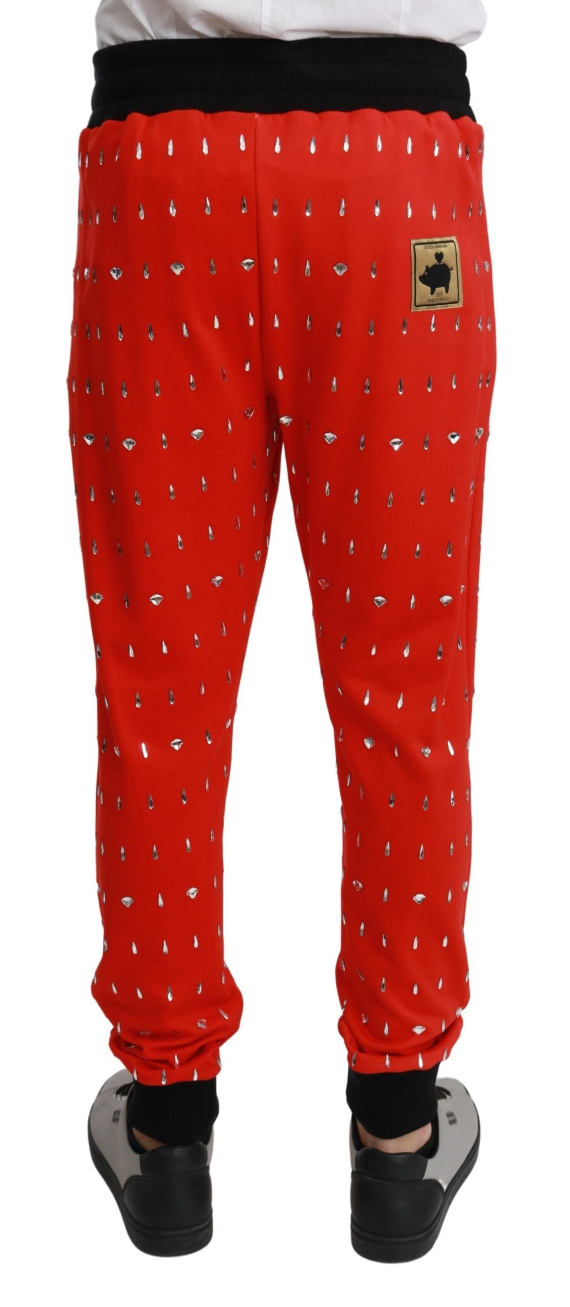 Pantalons Dolce & Gabbana en coton rouge avec détails en cristal, style piggy bank, vue frontnelle.