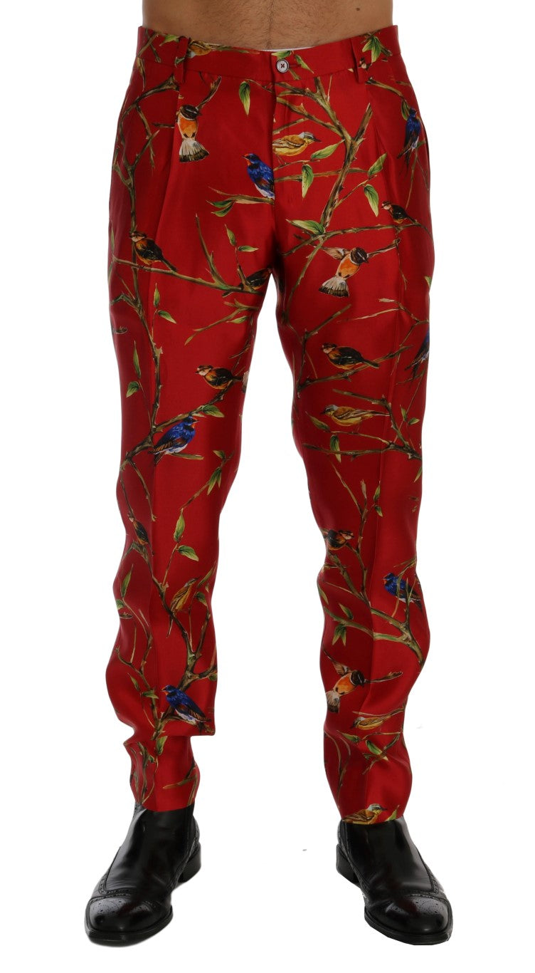 Pantalon de costume en soie rouge avec motif oiseaux Dolce & Gabbana, style élégant et sophistiqué pour femme.