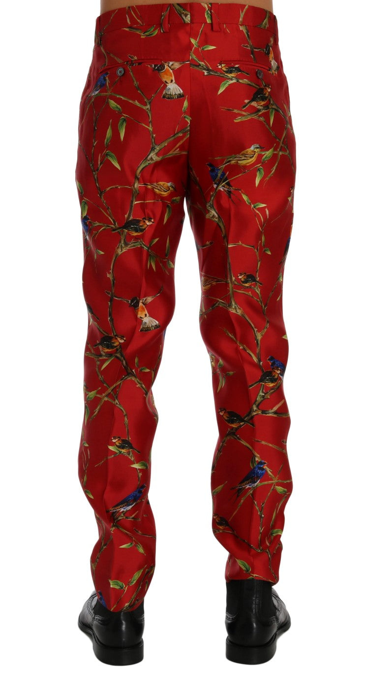 Pantalon de costume rouge en soie Dolce & Gabbana avec motif d'oiseaux, élégant et sophistiqué.