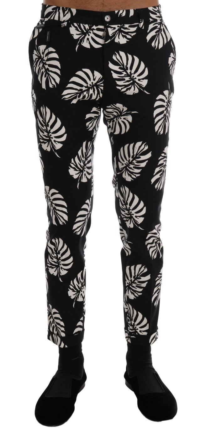 Pantalon slim en coton stretch blanc et noir avec motif feuilles de Dolce & Gabbana, style élégant et moderne.