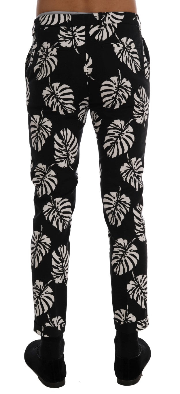 Pantalon slim en coton stretch blanc et noir avec motif feuille de Dolce & Gabbana, style élégant et moderne.