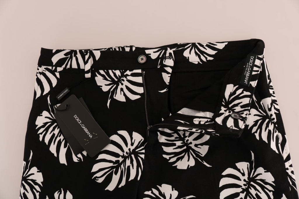 Pantalons slim en coton stretch noir et blanc avec motif de feuilles Dolce & Gabbana, style moderne et élégant.