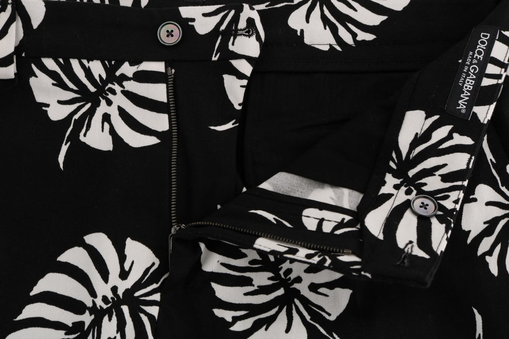 Pantalon slim en coton stretch blanc et noir avec motif feuillage de la marque Dolce & Gabbana, vue de face.