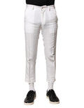 Pantalons courts en lin blanc Dolce & Gabbana, taille moyenne, coupe décontractée, vue de devant sur un mannequin.