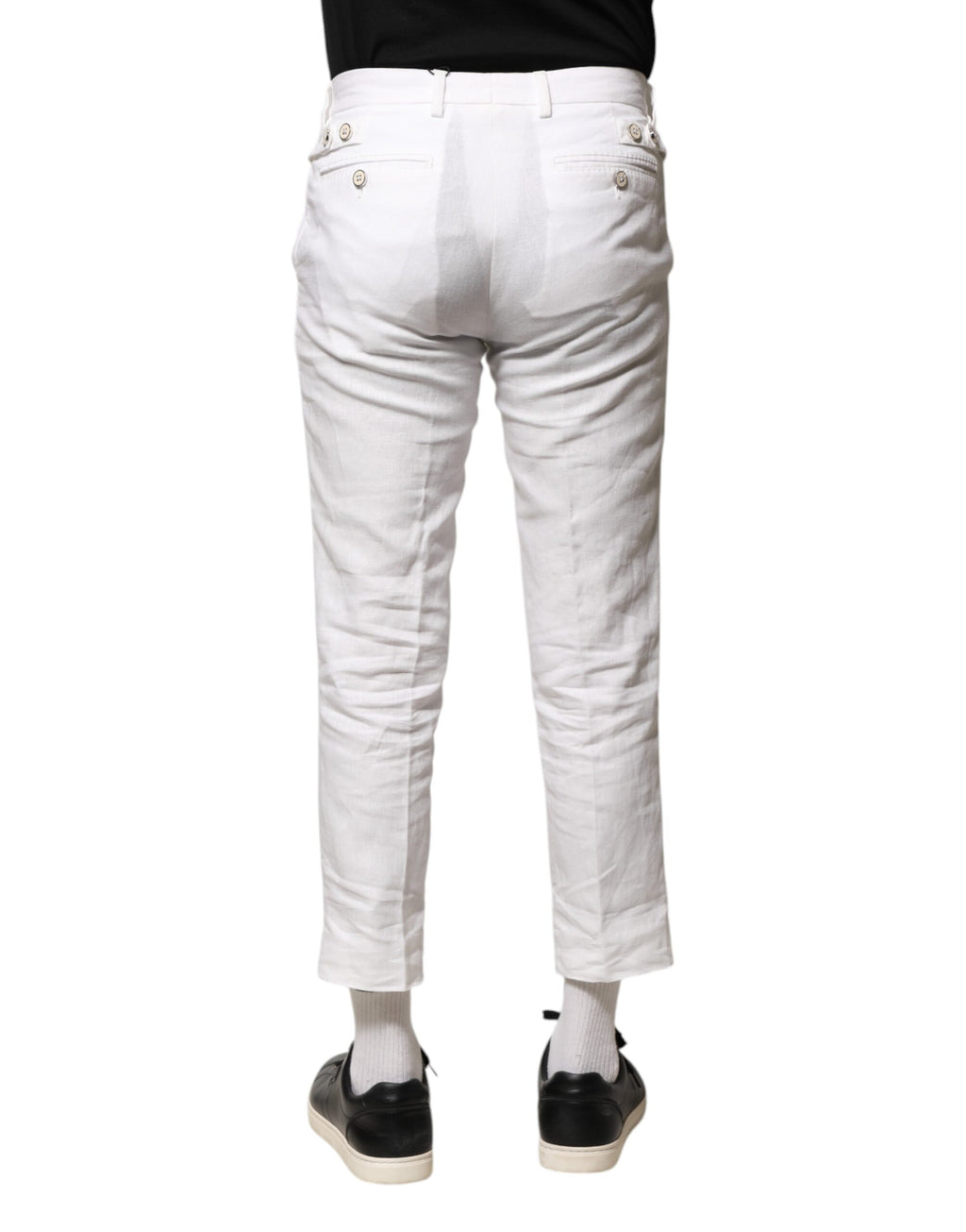 Pantalons courts en lin blanc Dolce & Gabbana, taille moyenne, avec coupe élégante et détails sophistiqués visibles sur l'image.