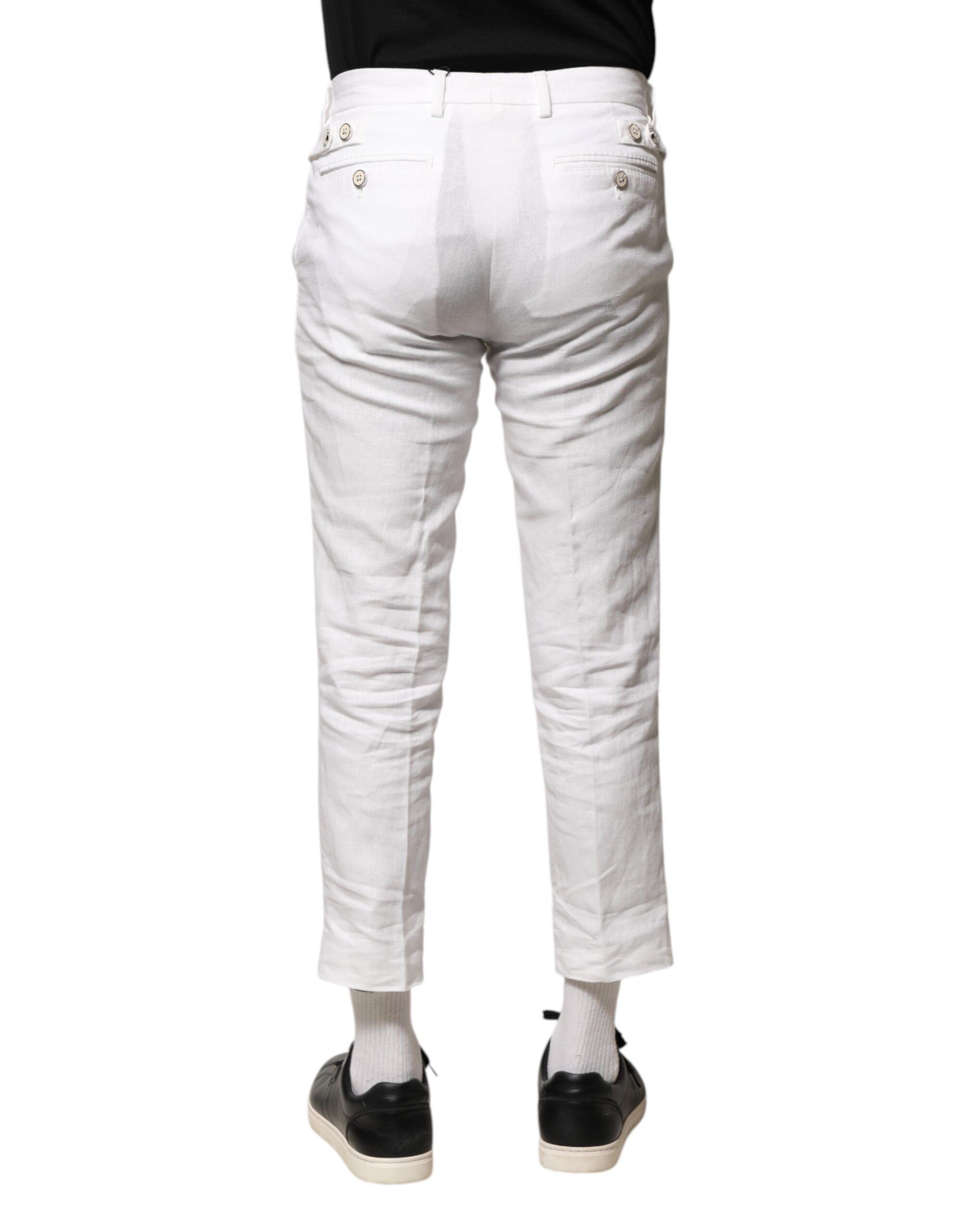 Pantalons courts en lin blanc Dolce & Gabbana, taille moyenne, avec coupe élégante et détails sophistiqués visibles sur l'image.
