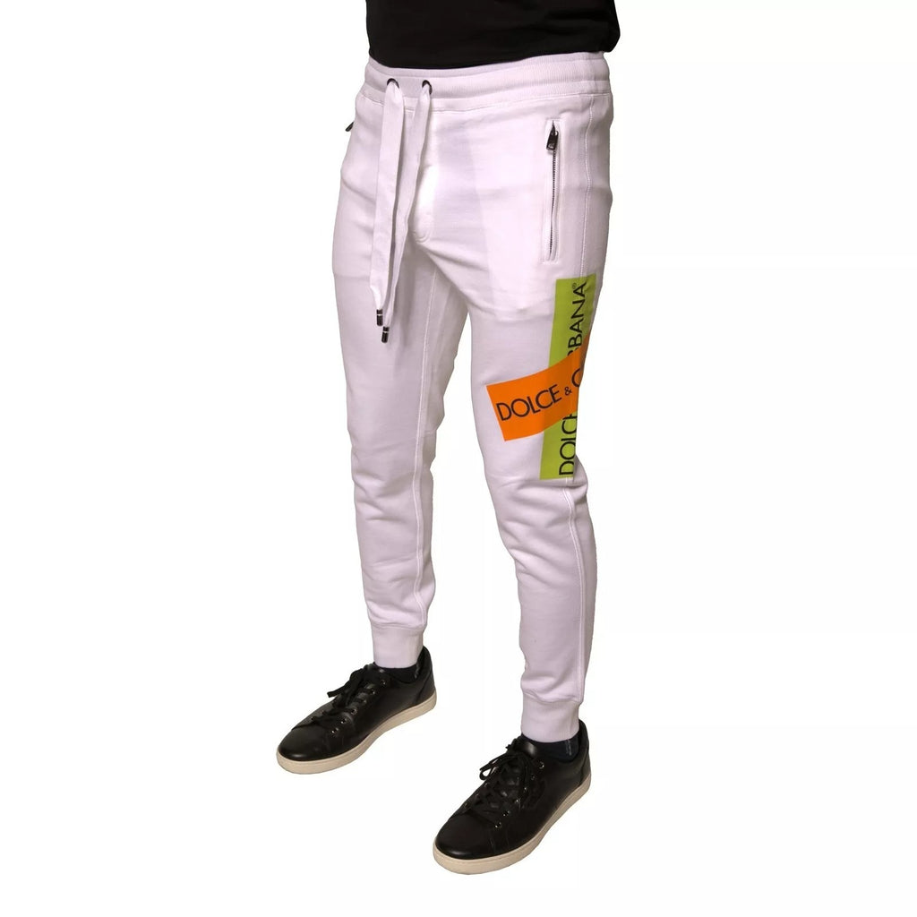 Pantalon jogger blanc en coton Dolce & Gabbana avec bande logo, style décontracté et confortable.