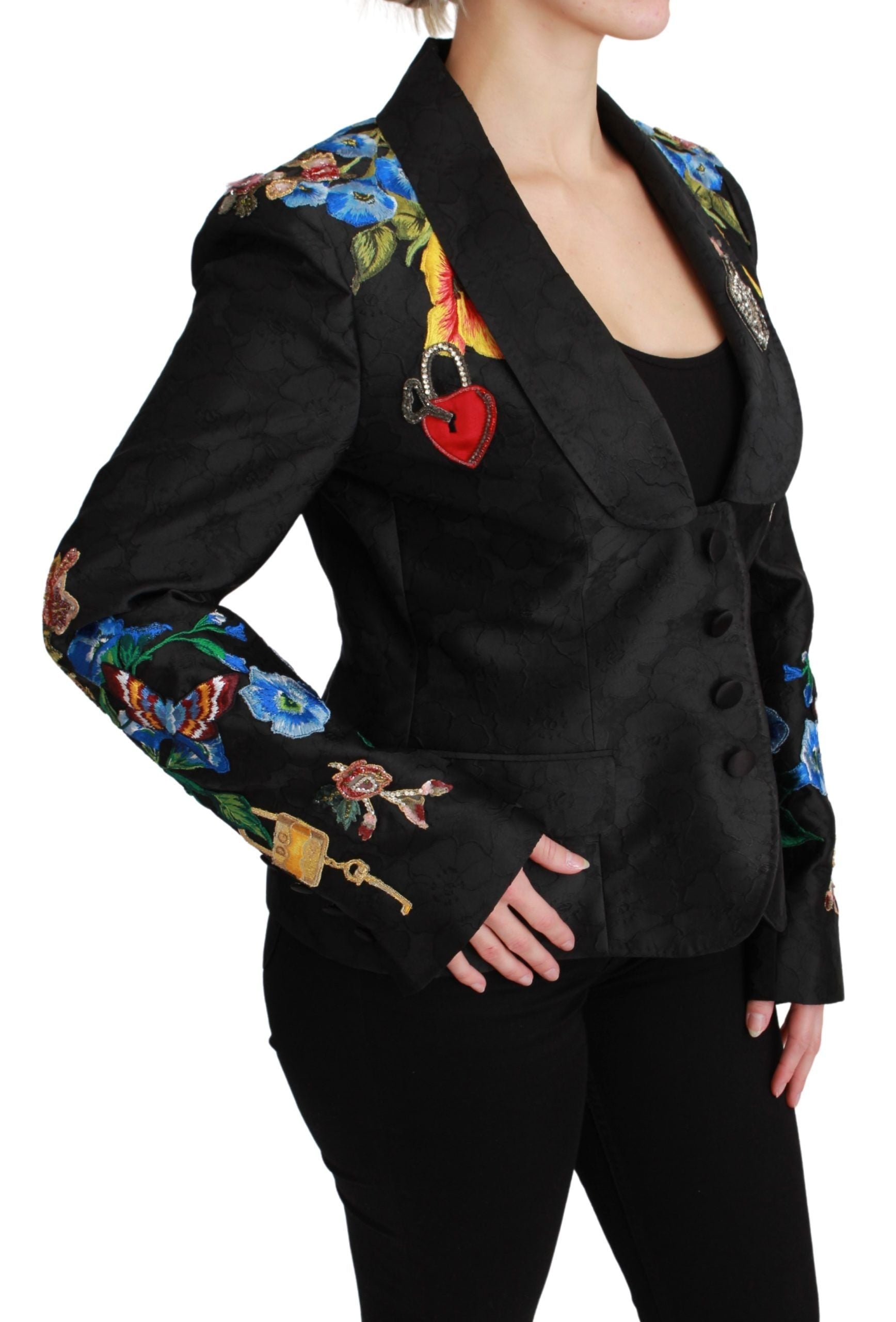 Veste blazer Dolce & Gabbana noire en brocart avec cristaux, élégante et sophistiquée, vue de face sur un mannequin.