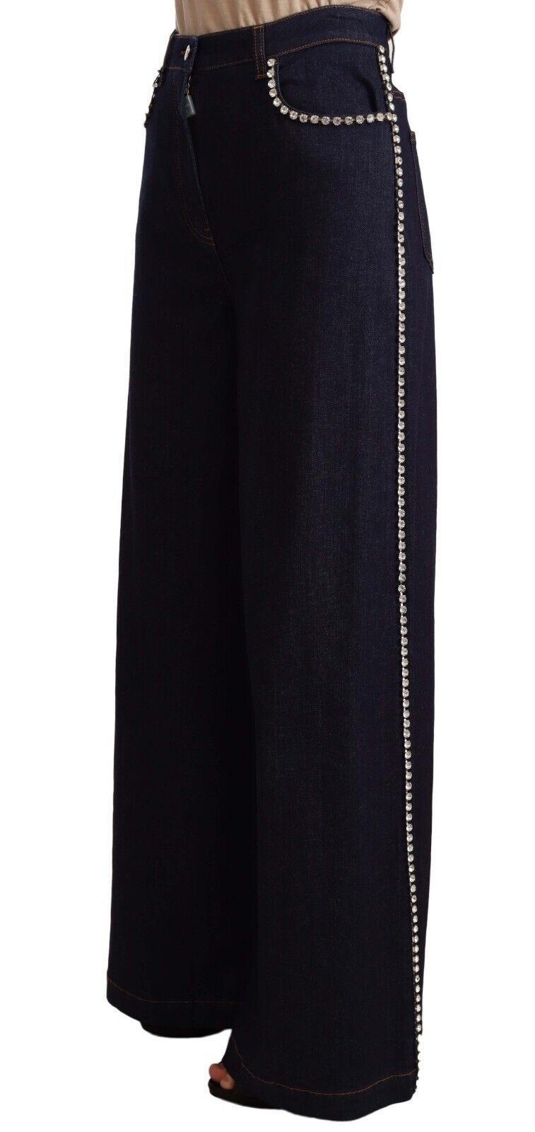 Jeans flare bleu foncé Dolce & Gabbana ornés de cristaux, vue détaillée du pantalon en denim avec embellissements.