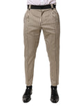 Pantalons slim en coton crème et noirs à rayures de Dolce & Gabbana, style élégant et ajusté, vue de face.