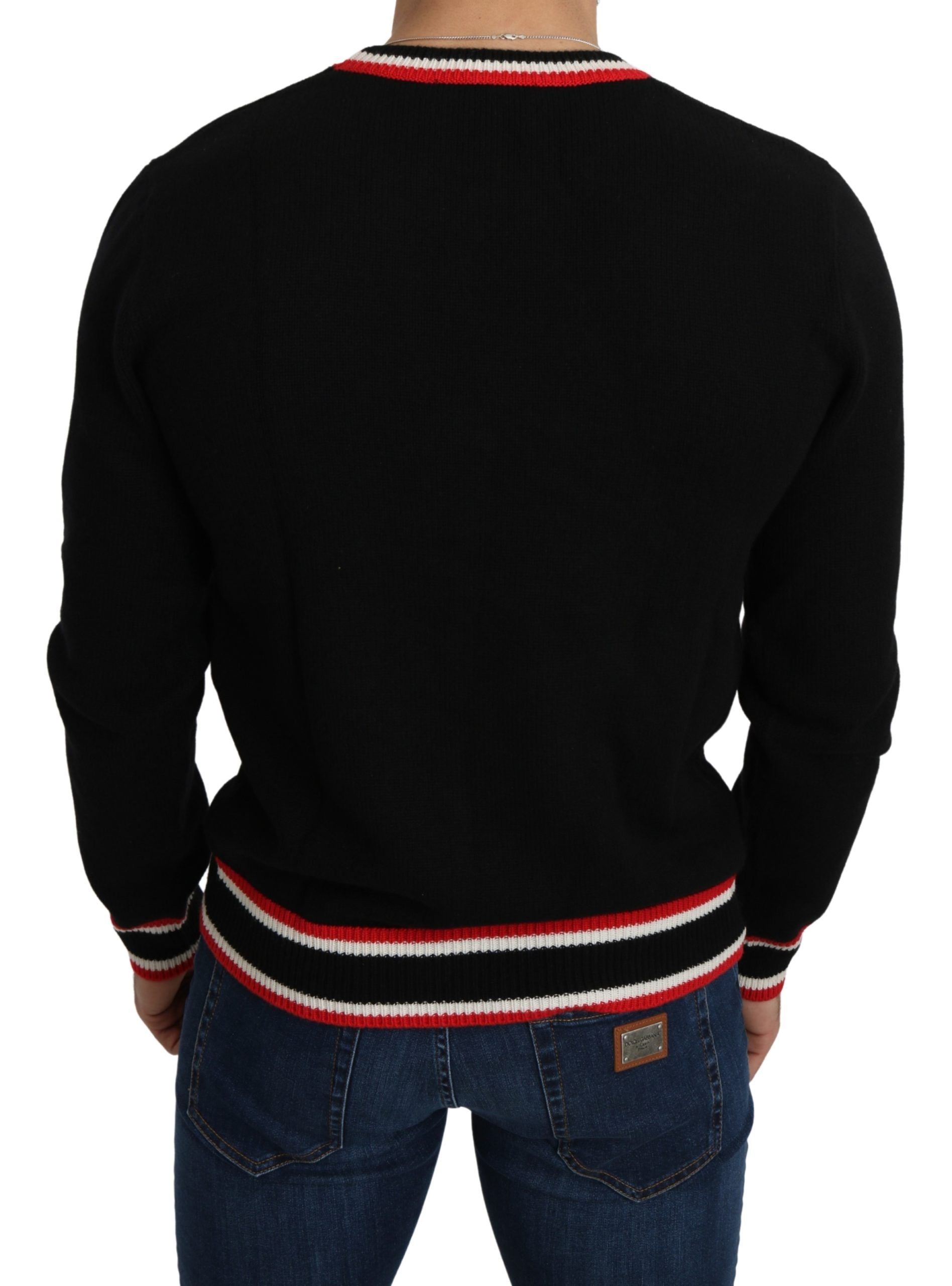 Pull Dolce & Gabbana en cachemire noir avec motif de cochon, style élégant et confortable pour homme.