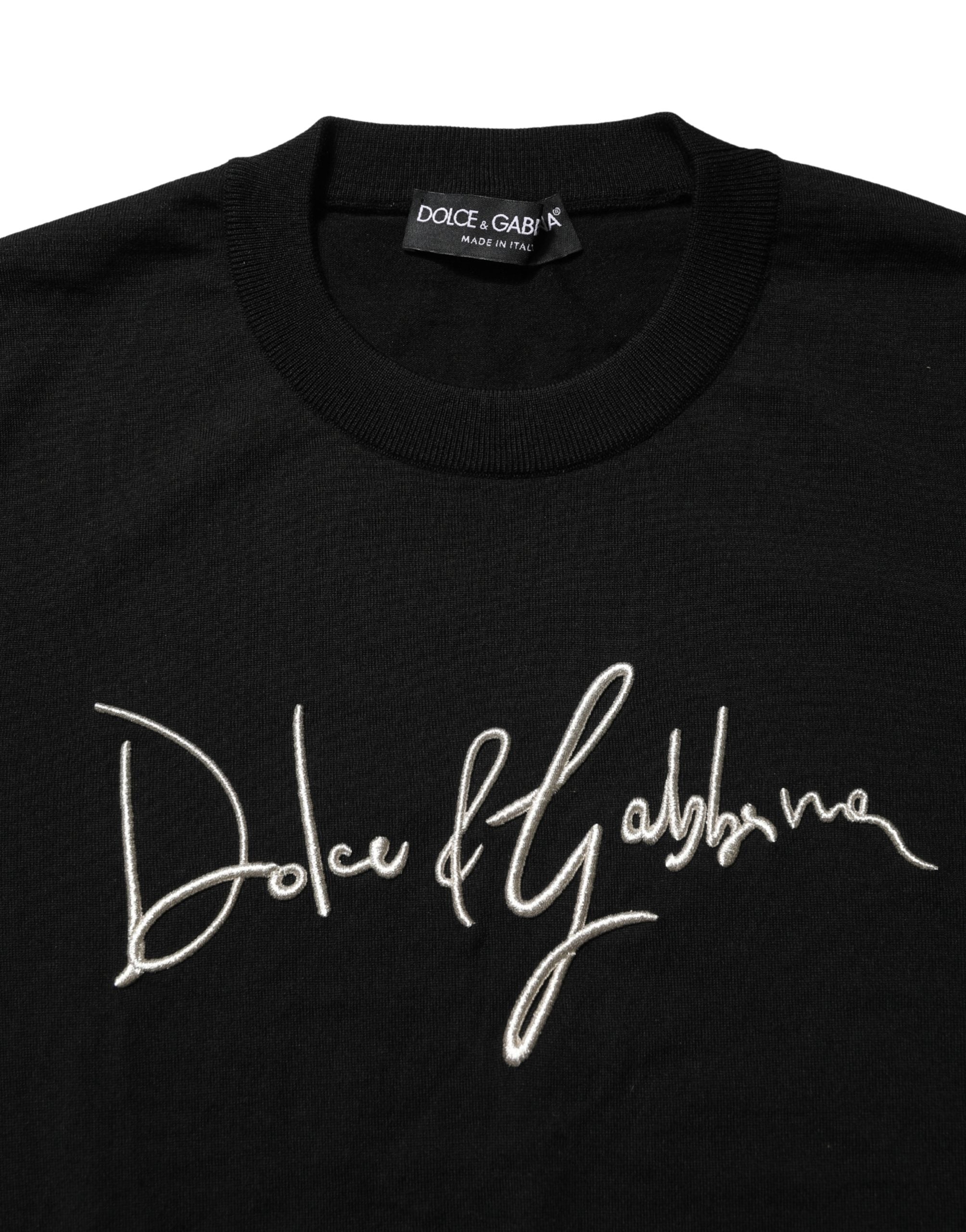 Pull noir Dolce & Gabbana en laine avec logo brodé, col rond et style décontracté visible sur l'image.