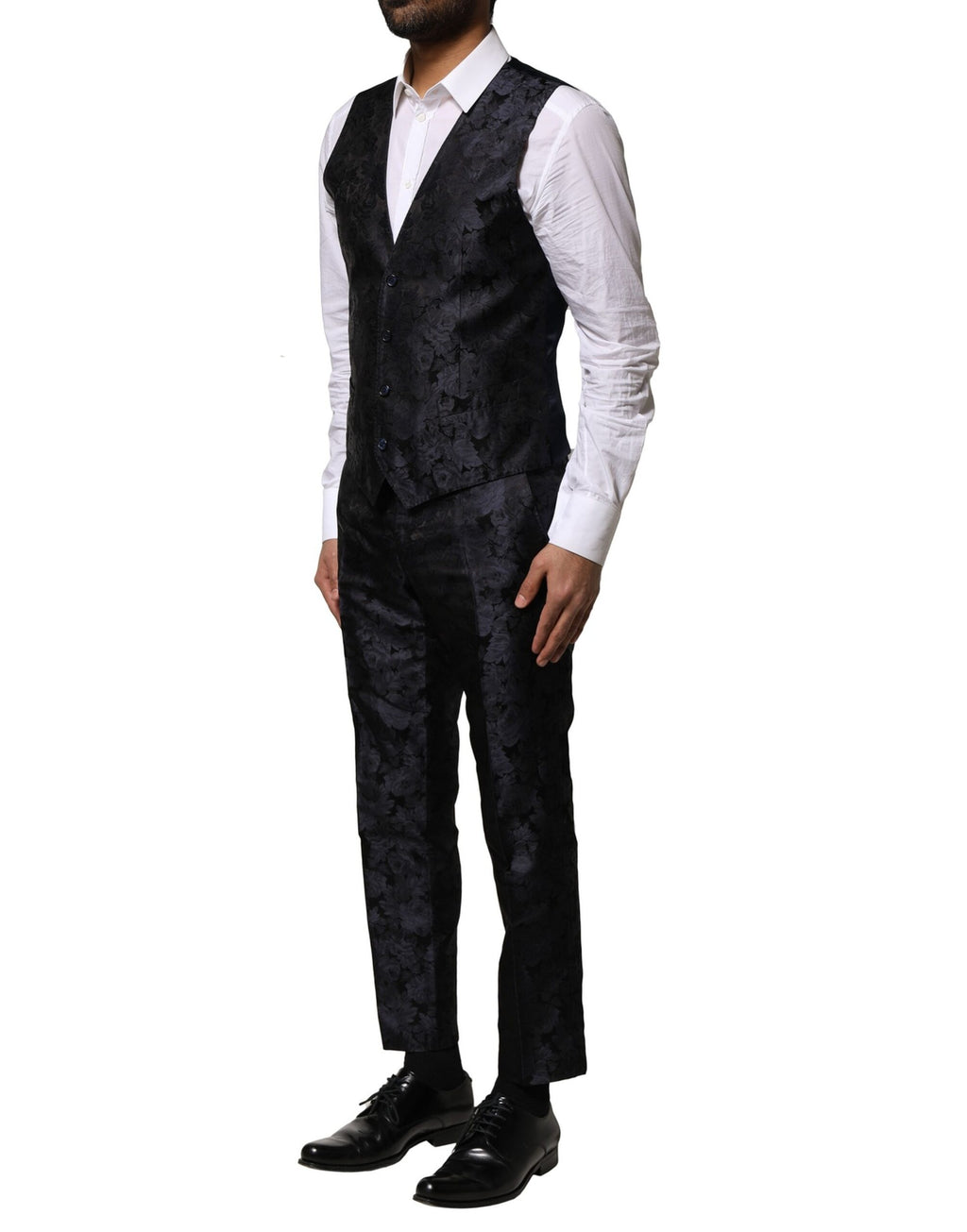 Costume noir en jacquard Dolce & Gabbana à trois pièces, veste à un bouton, pantalon et gilet élégants.