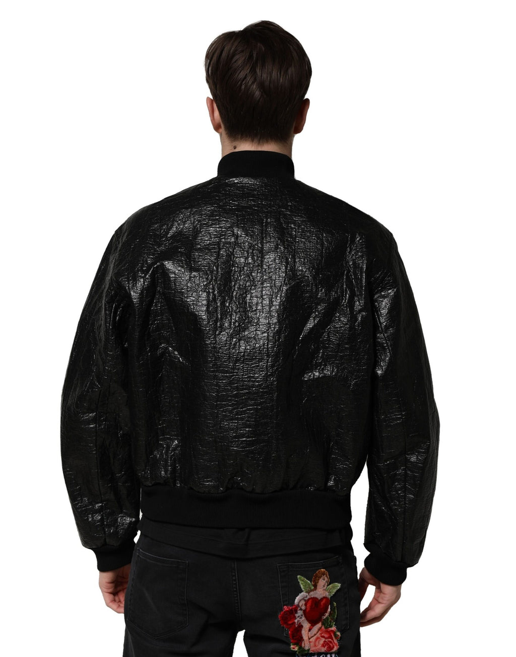 Veste bomber noire Dolce & Gabbana avec plaque logo, fermeture éclair complète, style élégant et moderne.
