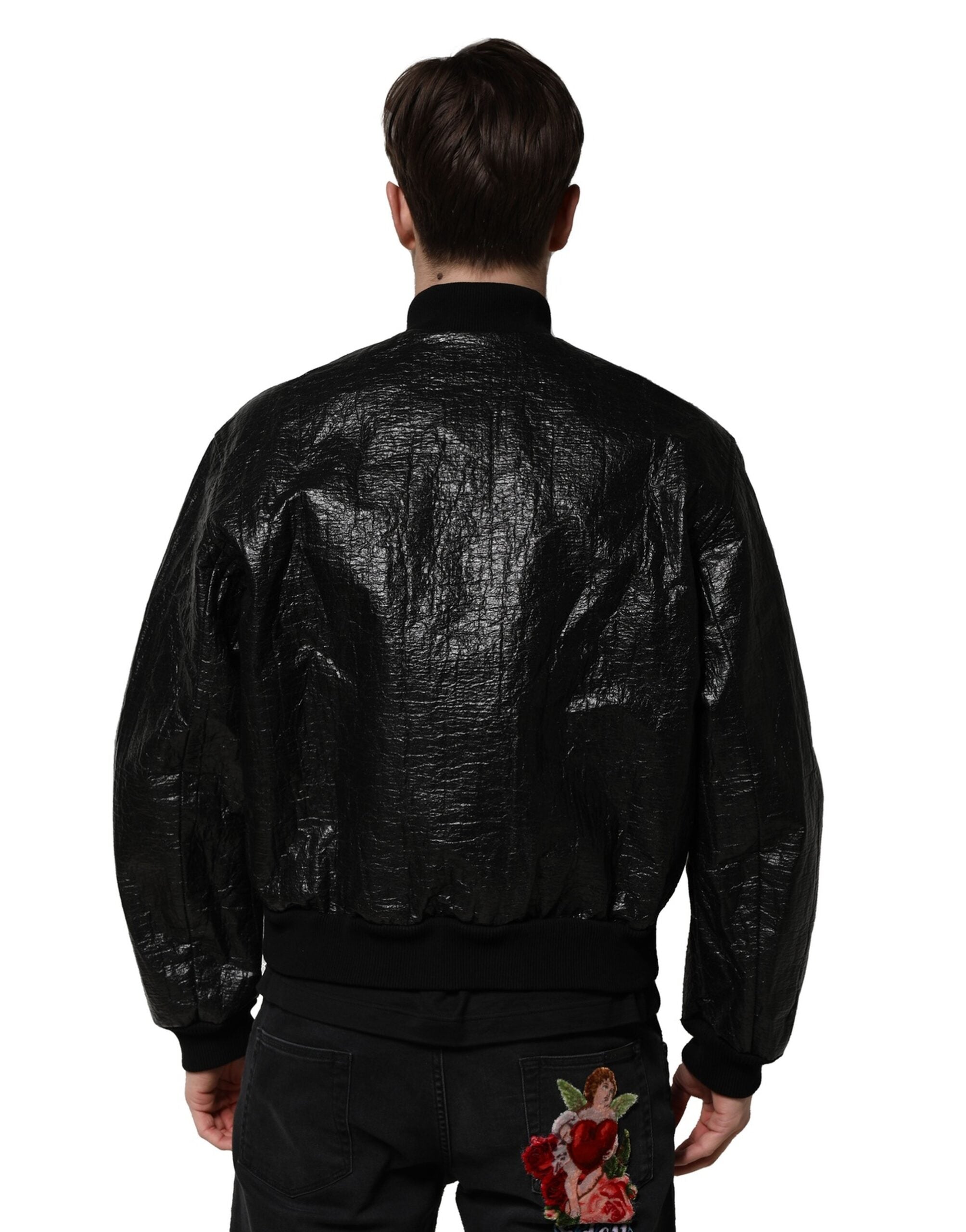 Veste bomber noire Dolce & Gabbana avec plaque logo, fermeture éclair complète, style élégant et moderne.