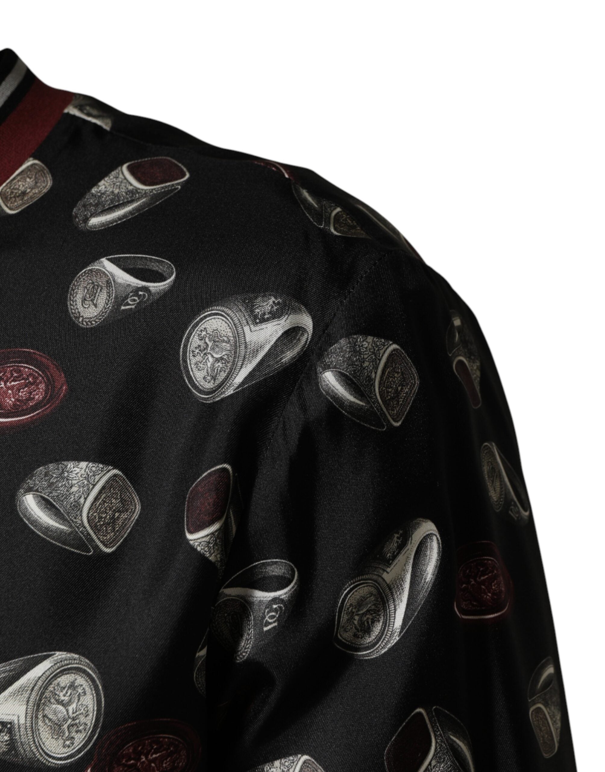Sweatshirt noir Dolce & Gabbana à col rond avec imprimé de bagues, style décontracté et tendance pour homme.