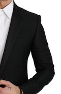 Blazer noir Dolce & Gabbana coupe slim, veste élégante en tissu sophistiqué, idéale pour un look chic et moderne.