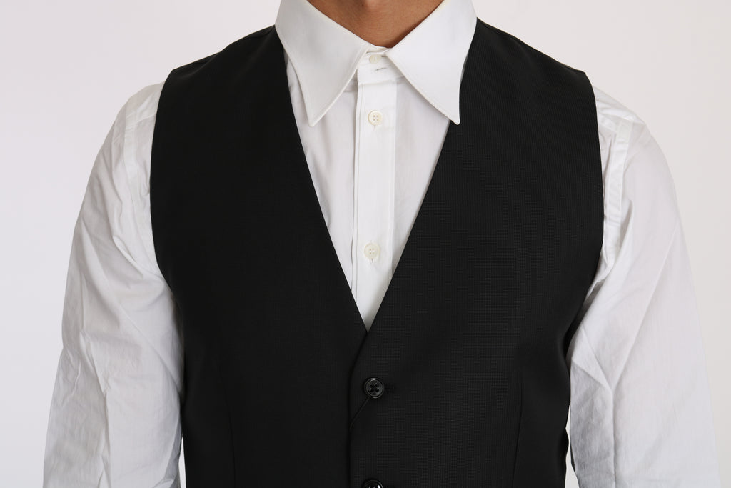 Gilet en laine et soie noire de Dolce & Gabbana, veste cintrée élégante pour homme, détail de tissu visible.