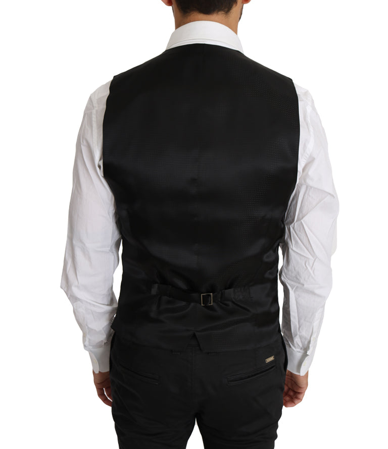Gilet en laine et soie noire de Dolce & Gabbana, veste cintrée élégante pour homme, détails en tissu solide, style sophistiqué.