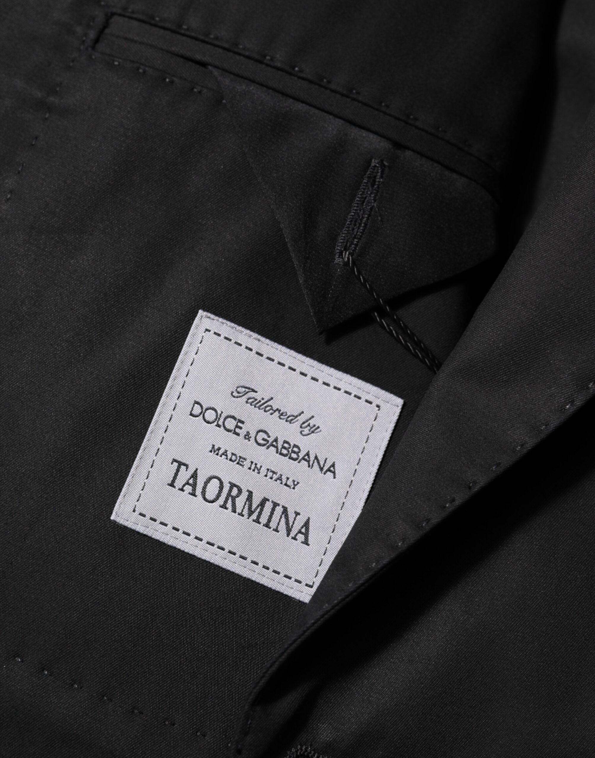 Costume homme Dolce & Gabbana en laine noire avec deux boutons, veste blazer élégante et sophistiquée.
