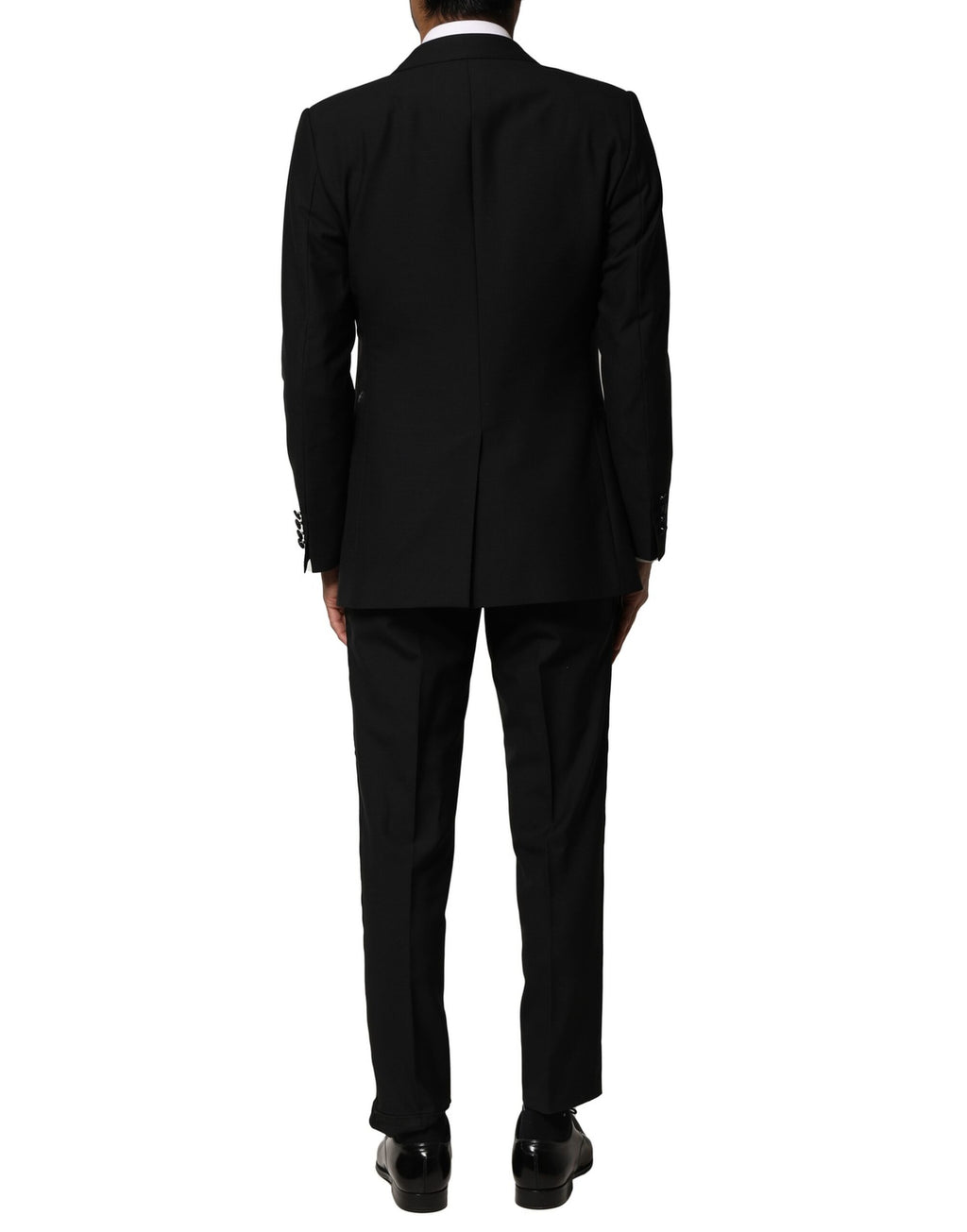 Costume trois pièces noir en laine de Dolce & Gabbana, veste à simple boutonnage, pantalon et gilet élégants.