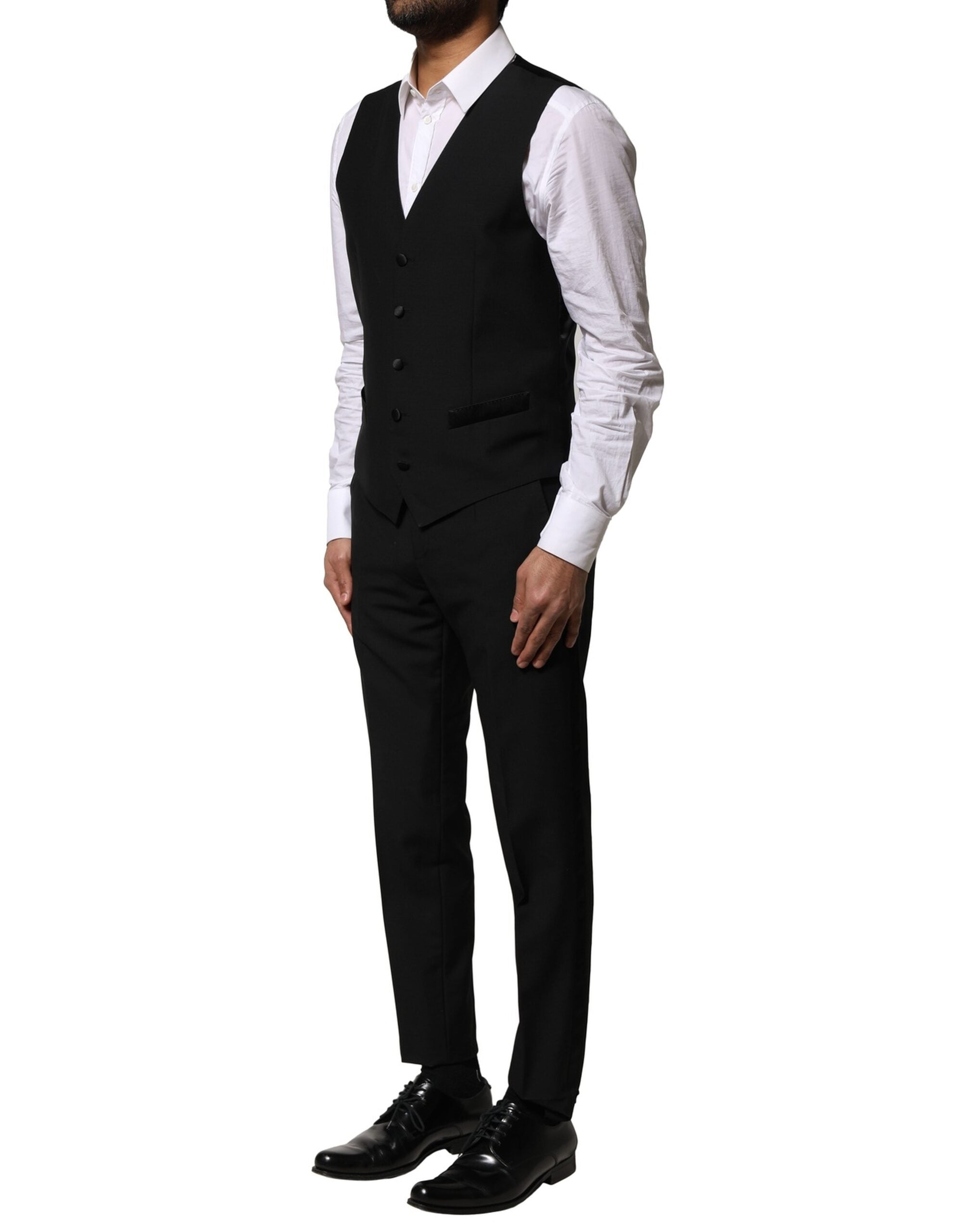 Costume trois pièces en laine noire de Dolce & Gabbana, veste à un bouton, pantalon et gilet élégants.